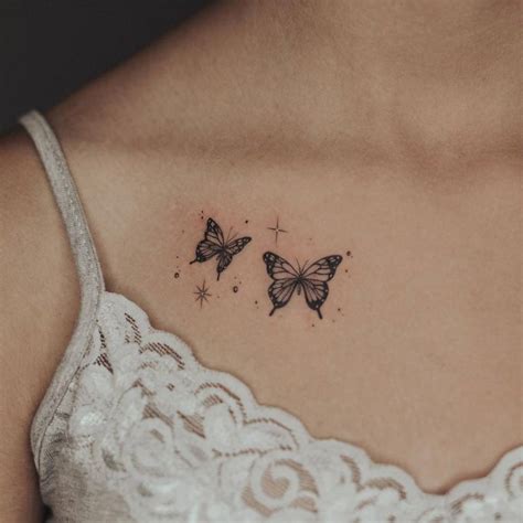 collar bone small butterfly tattoo on chest|Delicate Butterfly Tattoo Ideas for Collar Bone